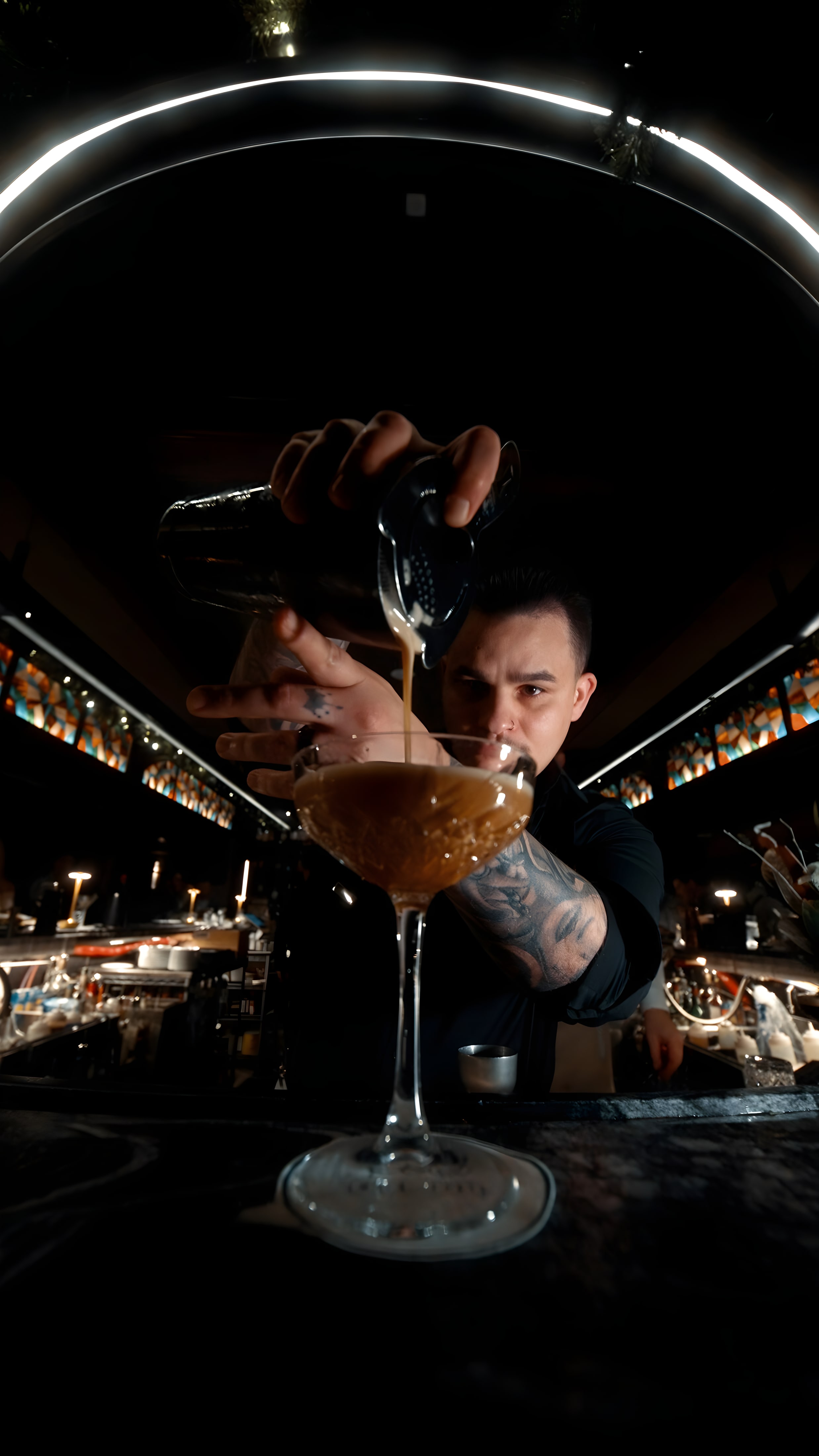 Inside Ember & Eagle: the kitchen at work and guests over wine and pasta
