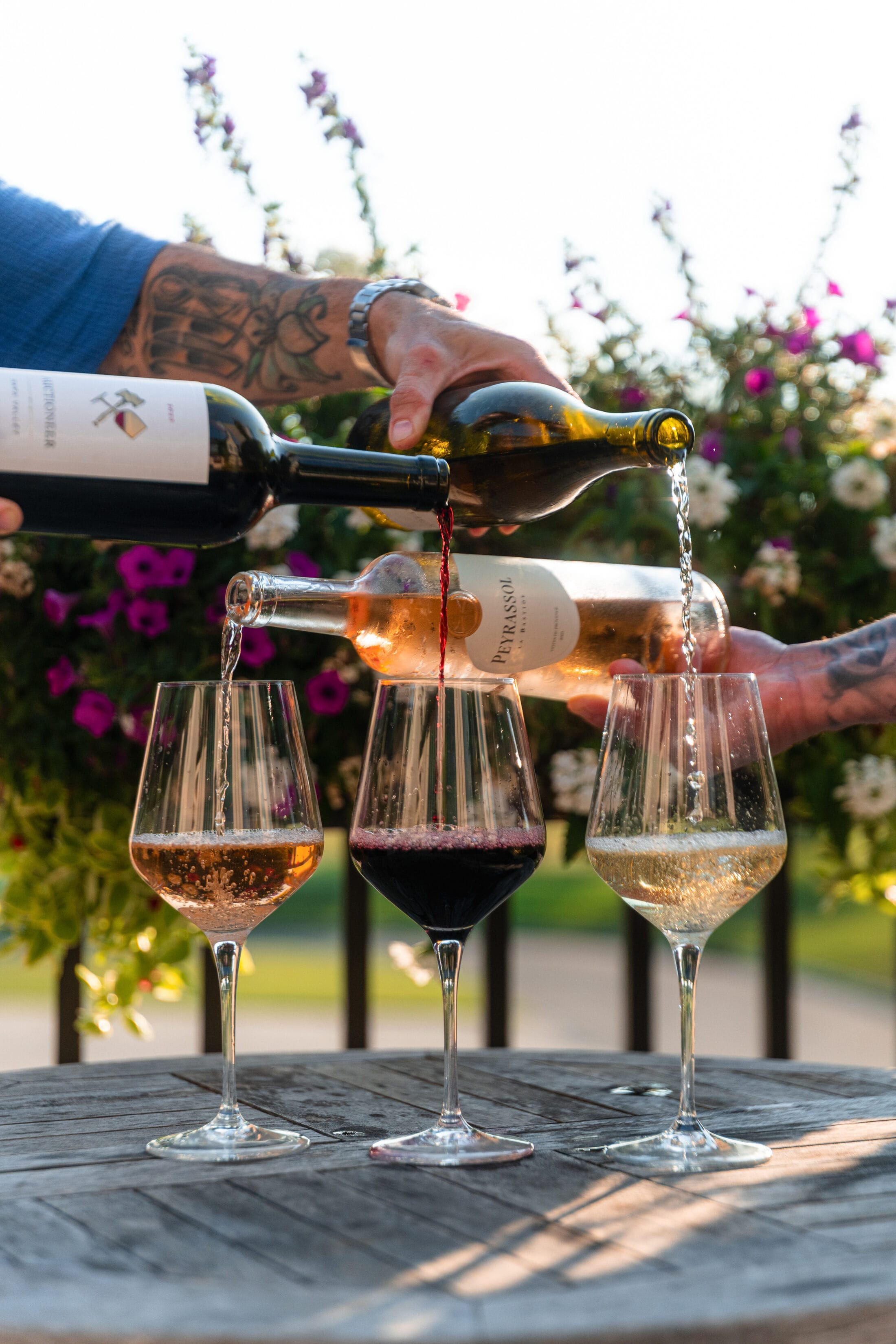 Red, white, and rosé poured together on the terrace at Ember & Eagle
