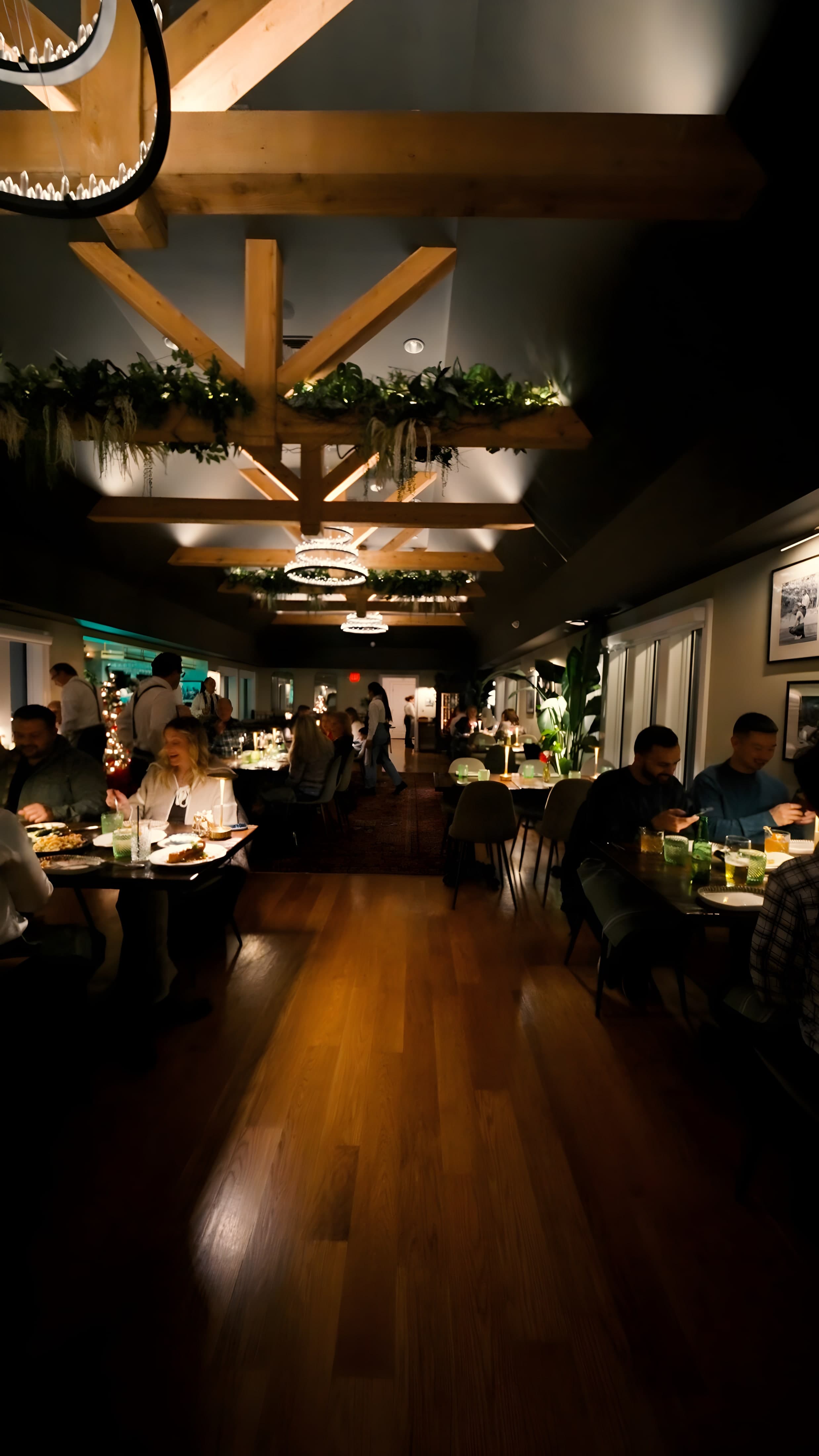 The warm, beamed dining room at Ember & Eagle, Eatontown NJ