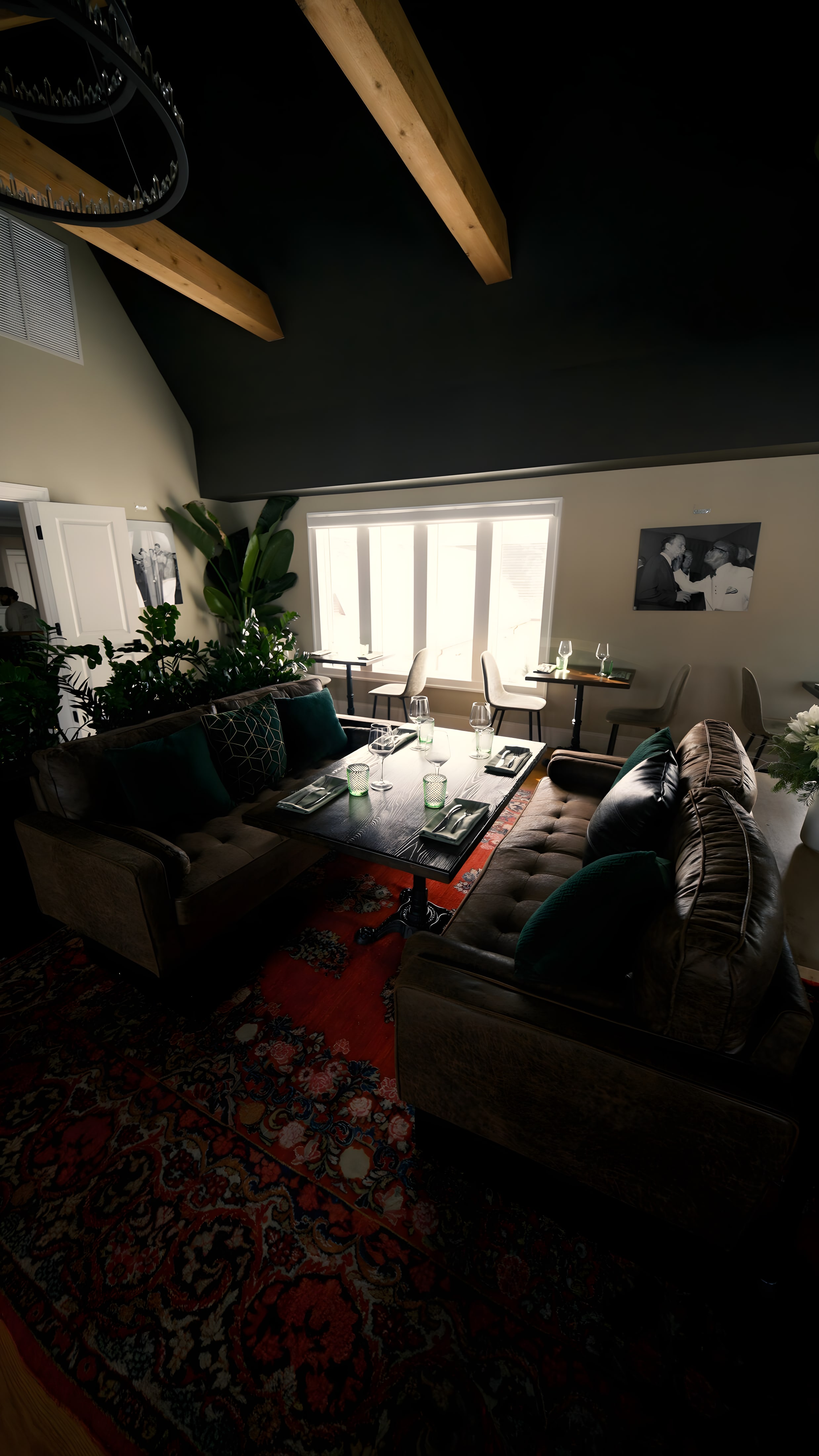 The Parlor lounge at Ember & Eagle, set with sofas and lamplight
